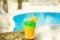 Colorful tropical cocktails on wooden bar. Mixology in pool holiday setting. Caribbean cocktails. Colorful cocktails in caribbean