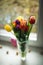 Colorful tulips in a vase on as a valentines gift. Bouquet of tulips lying on windowsill. Top of view. Natural background. Concept