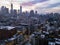 Colorful twilight of sunset shines in the sky above the buildings of the lower Manhattan skyline in New York City