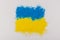 Colorful Ukrainan flag yellow blue color holi paint powder explosion isolated on white background. russia ukraine conflict war