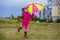 Colorful umbrella cute girl jump funny to sky