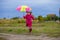 Colorful umbrella cute girl jump funny to sky