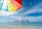 Colorful umbrella on paradise white sand beach and blue sky in sandbank island, Maldives