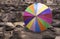 Colorful umbrella on rock
