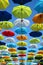 Colorful umbrellas background. Colorful umbrellas in the sunny sky. Street decoration