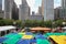 Colorful umbrellas contrast the Chicago skyline.