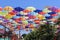 Colorful umbrellas flying in the blue sky