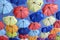 Colorful umbrellas flying in the blue sky