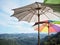 colorful umbrellas over mountains and blue sky