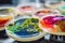 Colorful variety of microorganism inside petri dish plate in laboratory with super macro zoom background, including of bacteria,