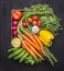 Colorful various of organic farm vegetables with fresh carrots with cherry tomatoes, garlic, lemon radish, peppers, cucumbers on w