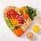 Colorful vegan Charcuterie board with raw vegetables and whole wheat snacks