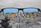 Colorful view of red roods and blue sea in Looking through glasses