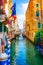 Colorful view of a scenic canal, Venice.