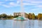 Colorful vintage fountain , business buildings and autumn trees at Lake Eola Park in Orlando Downtown area 2