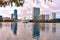 Colorful vintage fountain , business buildings, swan boats and autumn trees at Lake Eola Park in Orlando Downtown area 2