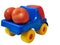 Colorful vivid toy car truck full of red tomatoes