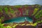 Colorful volcanic crater filled with blue water, Iceland