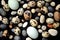 Colorful Wallpaper background conceptual photo with quail eggs and stones