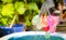 Colorful water balloons play in plastic swimming pool