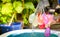 Colorful water balloons play in plastic swimming pool