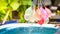 Colorful water balloons play in plastic swimming pool