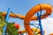 Colorful water Park twisted water slide amusement resort for luxury children and family vacations on a warm sunny tropical day