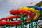 Colorful water Park twisted water slide amusement resort for luxury children and family vacations on a warm sunny tropical day