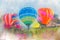 Colorful  watercolor painting balloon above a flower field at a national balloon festival