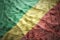 Colorful waving congolese flag on a dollar money background