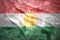 Colorful waving kurdish flag on a euro background