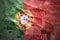 Colorful waving portuguese flag on a euro background