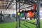 Colorful weights of various sizes or kettlebell heavy iron hang on the rail at gym for exercise or bodybuilding