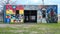 Colorful western themed murals on a building on Singleton Blvd in Dallas, Texas.