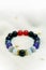 Colorful in white blue black red lucky stone bracelet bead on white towel background.fashion with believe in Add charm,property, h