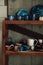 Colorful, white and blue ceramic cups and dishes on shelves of pottery store