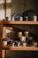 Colorful, white and blue ceramic cups and dishes on shelves of pottery store