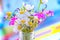 Colorful wildflowers background bottle vivid bright light daisy violets