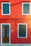 Colorful window of a house on the Venetian island of Burano, Venice. Facade of the houses of Burano close-up. Venice, Italy.