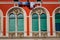 Colorful windows in Split courtyard complete with baby clothes drying on a line in the sun