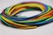 Colorful wires or cables used to connect different electronic components on white background