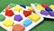 Colorful wood block toy on green grass