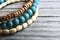 Colorful wooden bracelets on old wooden background.Handcrafted bangles.