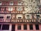 Colorful wooden building facadeand a blooming tree in Strasbourg city, France, Alsace