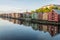 Colorful wooden buildings near Nidelva river in the city of Bakklandet/Trondheim in Norway.