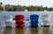 Colorful wooden chairs in a lake