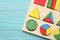 colorful wooden cubes on blue wooden background. Top view. Toys in the table