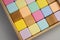 Colorful wooden cubes in a drawer. Eco-friendly materials.