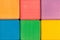 Colorful wooden cubes wall as background