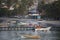 Colorful wooden fisher boats anchored in the bay of Pampatar wit